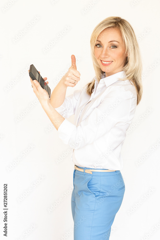 young business lady with a calculator. business portrait of a blonde woman in a blue suit.Business content.Isolated white background. young business lady with a calculator. business portrait of a blonde woman in a blue suit.Business content.Isolated white background.