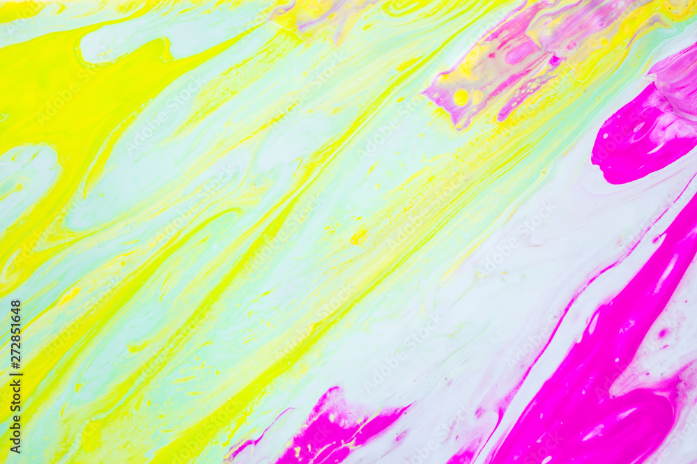Abstract colorful painting background made in fluid art technique.