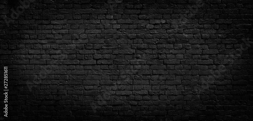 Old black brick wall background.