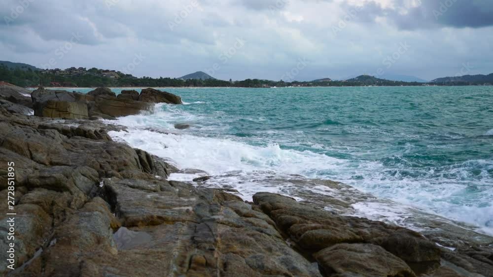 Sea wave were hitting in rock beach coastline in sunrise at Samui island, Thailand Sea wave were hitting in rock beach coastline in sunrise at Samui island, Thailand