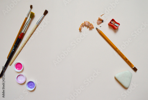 Three art brushes, purple, pink  dyes and pecils, earser, pencil shaving photo