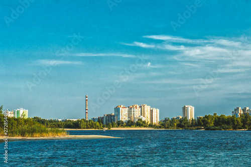 Cityscapes and skyline in clear blue sky on view from river