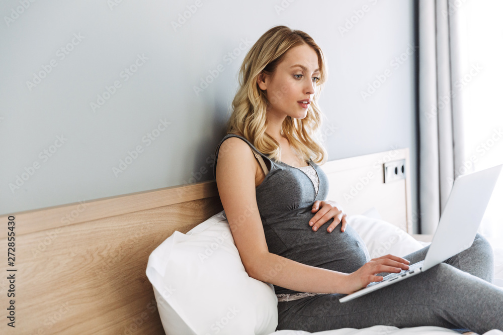 Attractive young pregnant blonde woman