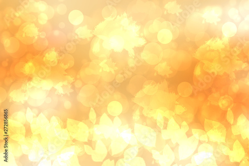 A festive abstract golden yellow gradient background texture with glitter defocused sparkle bokeh circles and leaves. Card concept for Happy New Year, party, invitation, valentine or other holidays.