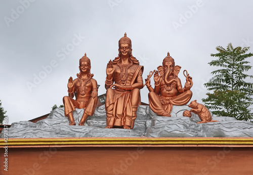 Hindu gods statue on temple roof