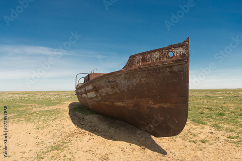 an old ship on land. at the bottom of the dried Aral sea