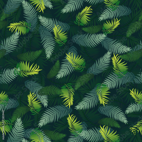 pattern with tropical leaves of different shapes and different shades of green on a dark green background