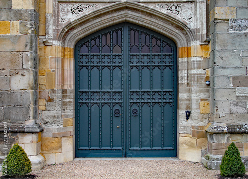 Old heavy ornate door in an old English manor house.