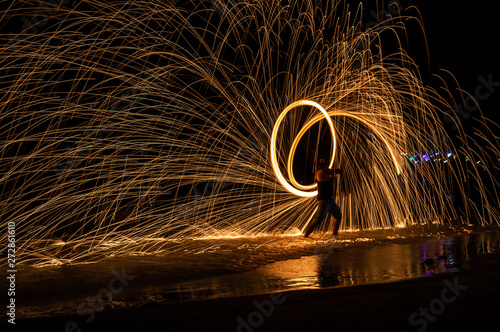 Swinging fire on the beach of Koh Samet