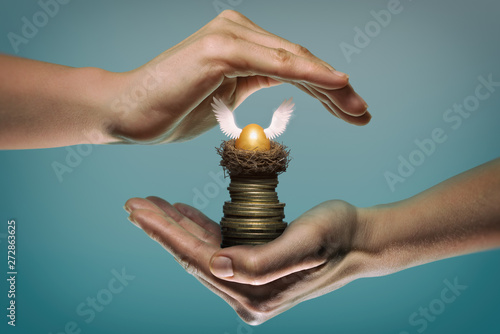 Принти на полотні Golden egg in nest on stack of coin