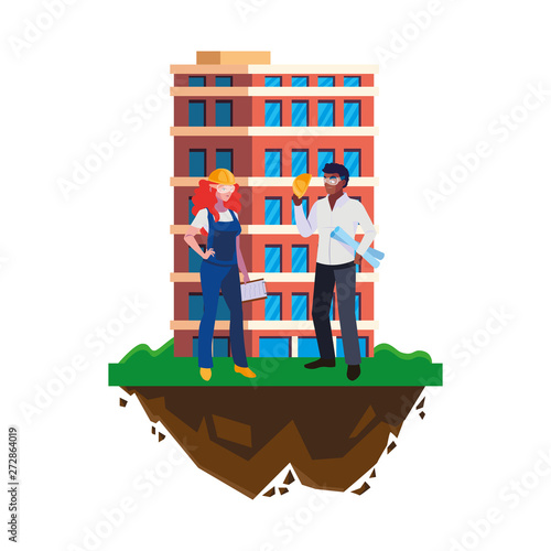 interracial couple of builders workers with building
