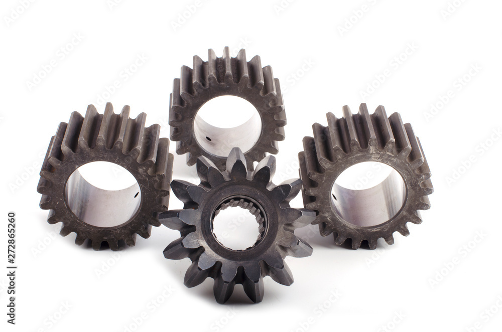 Small group of gears with their teeth engaged on a white background Small group of gears with their teeth engaged on a white background