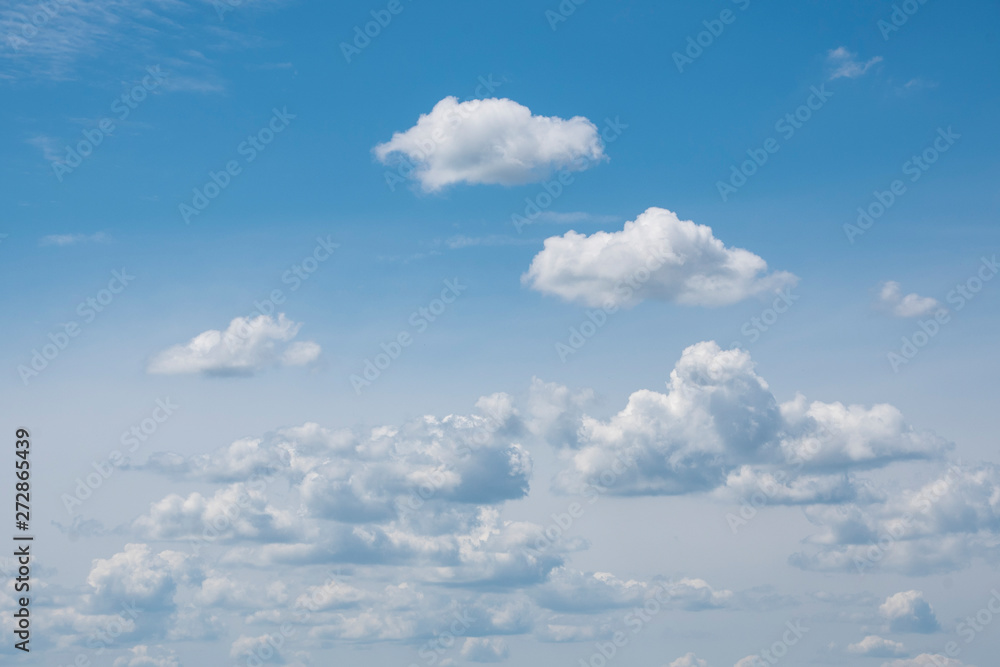White clouds on the blue sky. Abstract background with clouds on blue sky. In the clear sky high floating clouds. White clouds on the blue sky. Abstract background with clouds on blue sky. In the clear sky high floating clouds.