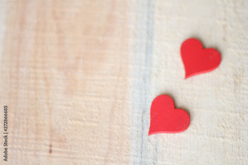 Two Red Hearts on a wooden background Two Red Hearts on a wooden background