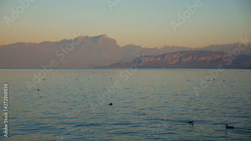 View of Lake Garda: beautiful blue water, sky and sharp mountain peaks (Alps and Dolomites) © centryfuga