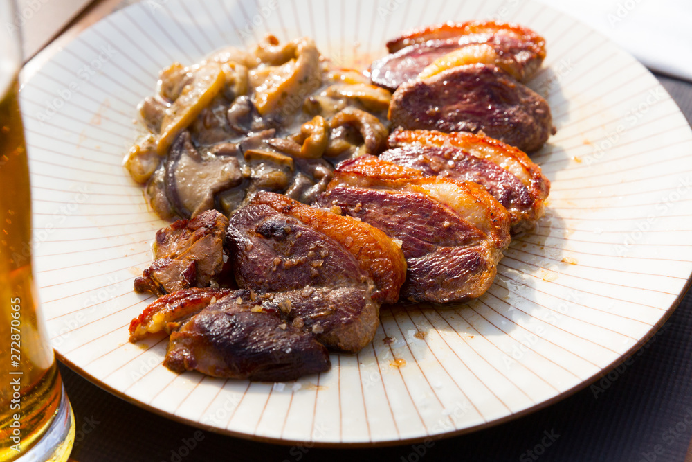 Fried duck breast Magre served with mushrooms