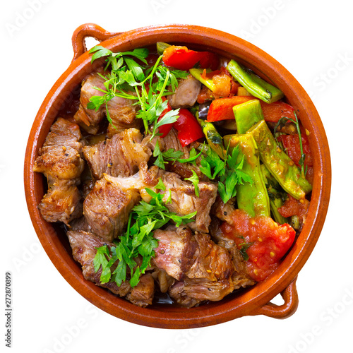 Cooked gyuvech dish of bulgarian cuisine of beef with vegetables at clay pot photo