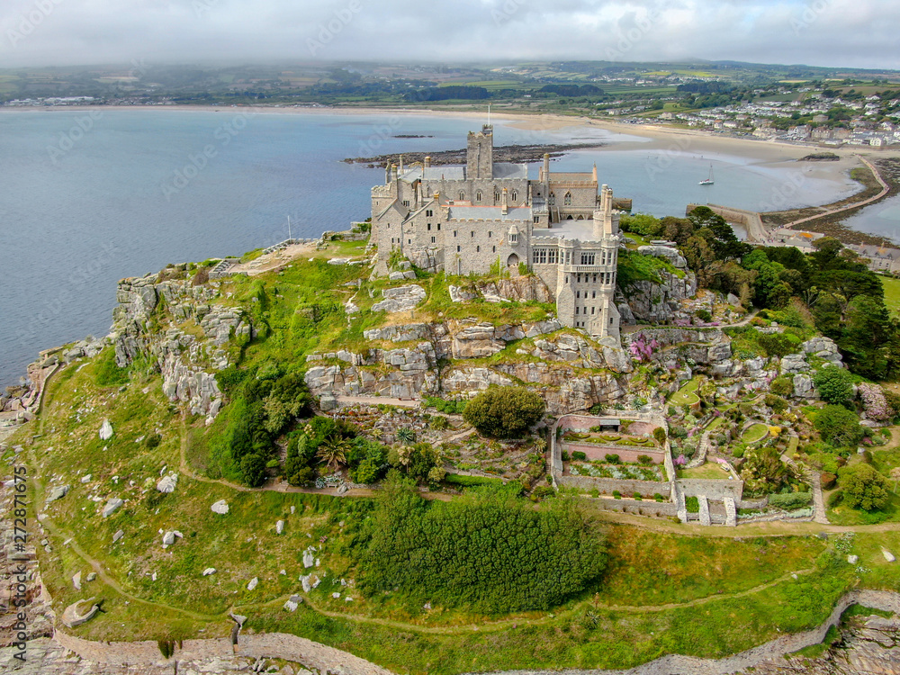 Aerial view St Michael's Mount is a small tidal island in Mount's Bay, Cornwall, England, United Kingdom. Castle and chapel on the top of the mount. 