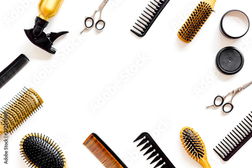 Set of professional hairdresser tools with combs and styling on white background top view frame mock up