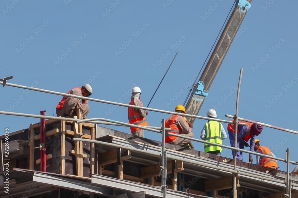 Blur background, no focusing -Abstract image for the background. Construction site workers.