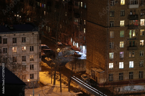 Residential buildings with luminous windows in a residential area in Moscow at night