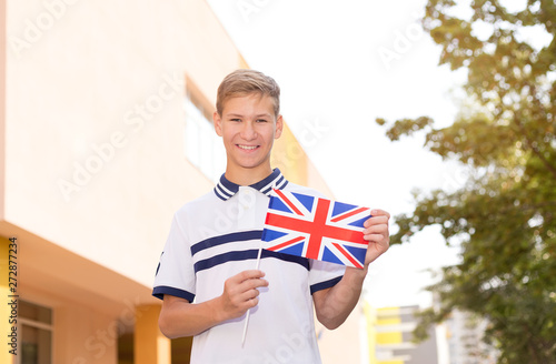 Teenager schoolboy with the flag of Great Britain. Study abroad. photo