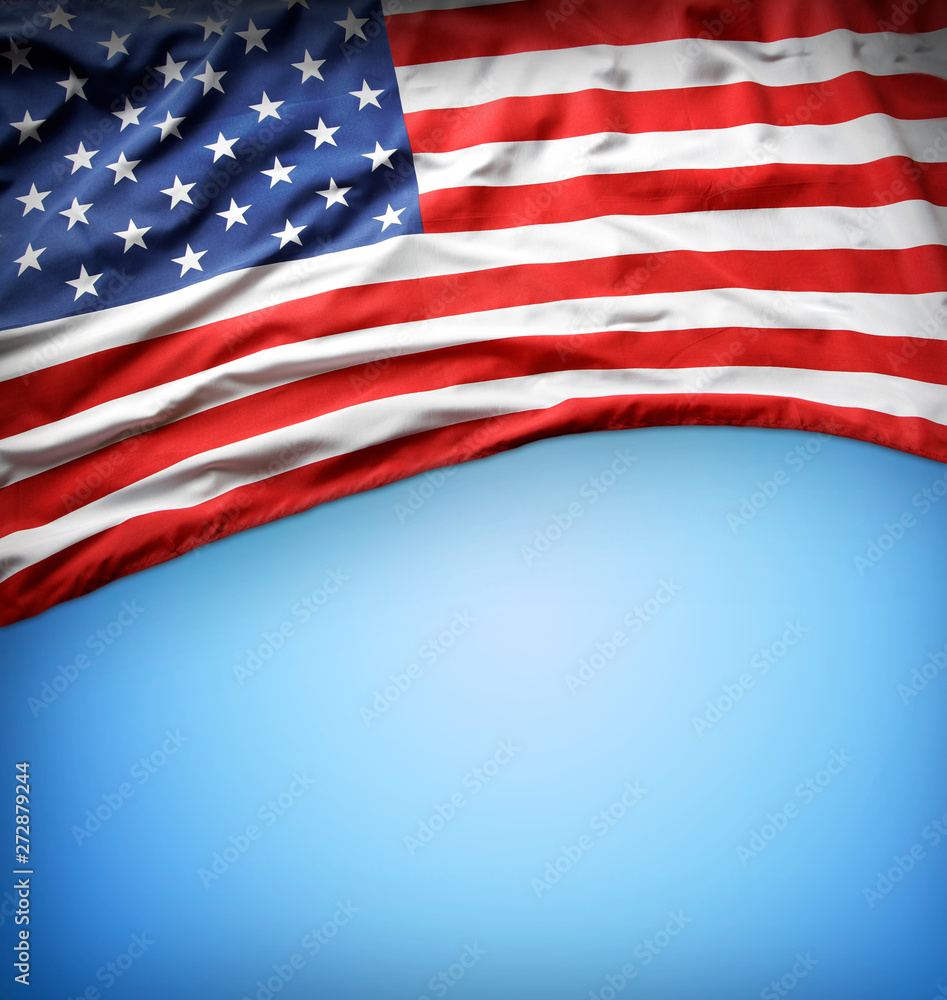 Obraz premium American flag on blue background. Copy space