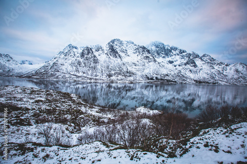 Beautiful panoramic winter view of Austnesfjorden, Sildpollen bay, Austvagoya island, Vagan Municipality, Nordland,  Lofoten Islands, Norway, with fjord and mountains © tsuguliev