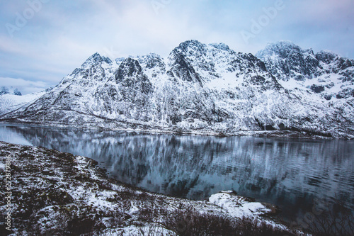 Beautiful panoramic winter view of Austnesfjorden, Sildpollen bay, Austvagoya island, Vagan Municipality, Nordland, Lofoten Islands, Norway, with fjord and mountains