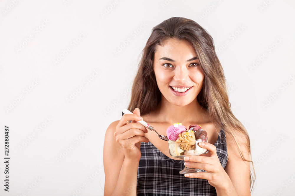 beautiful young woman eating ice cream