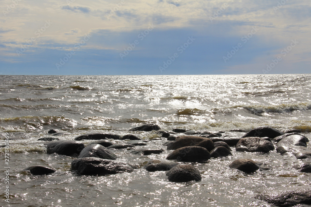 Fototapeta premium Large waves of sea and stones beach