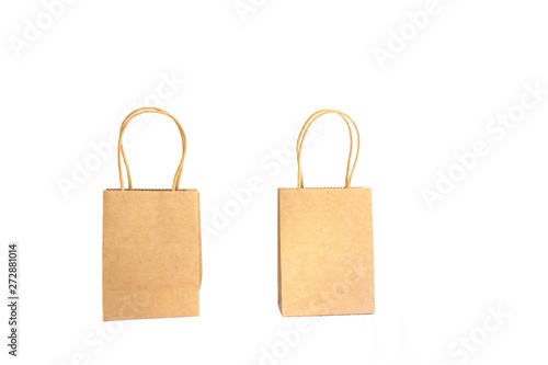 two brown paper shopping bags with hands isolated on white background