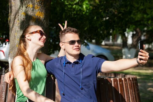 Couple in love. Romantic couple enyojing in moments of happiness in the park. Love and tenderness, dating, romance. Lifestyle concept photo