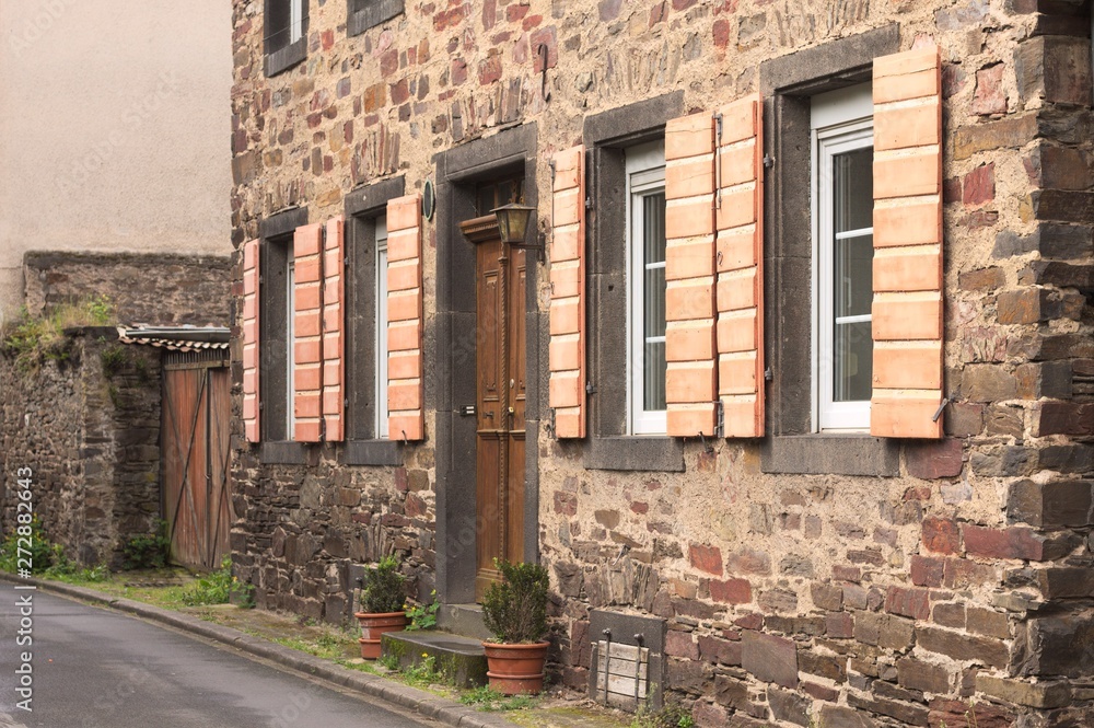 Fototapeta premium Traditional german house with wooden shutters (Moselkern, Germany, Europe)
