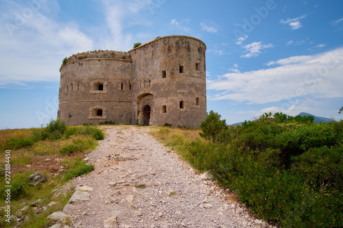 The road leading to the ancient fortress of Arza on a sunny day.