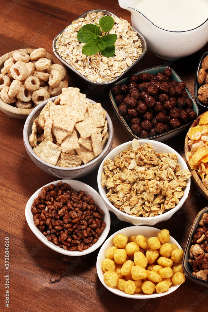 Cereal. Bowls of various cereals and milk for breakfast. Muesli with kids cereals. Cereal. Bowls of various cereals and milk for breakfast. Muesli with kids cereals.
