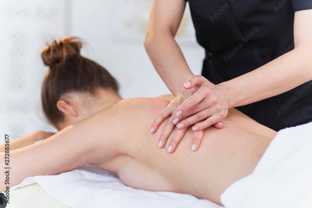 Young sport woman during treatment massage in the clinic. Young sport woman during treatment massage in the clinic.