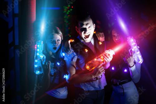 Friends with laser guns in colored beams