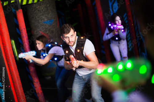 Emotional guy playing laser tag