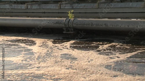 Broken pipeline and dirty sewage water flowing. Ecological catastrophe. photo