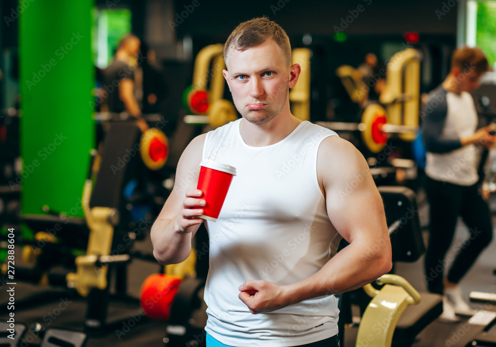 Young man drink coffee after exercise Young man drink coffee after exercise