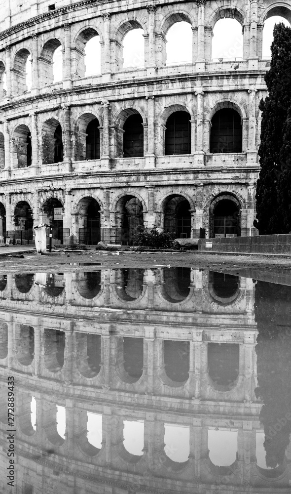 Colosseum, or Coliseum, reflected in the water, Rome, Italy.