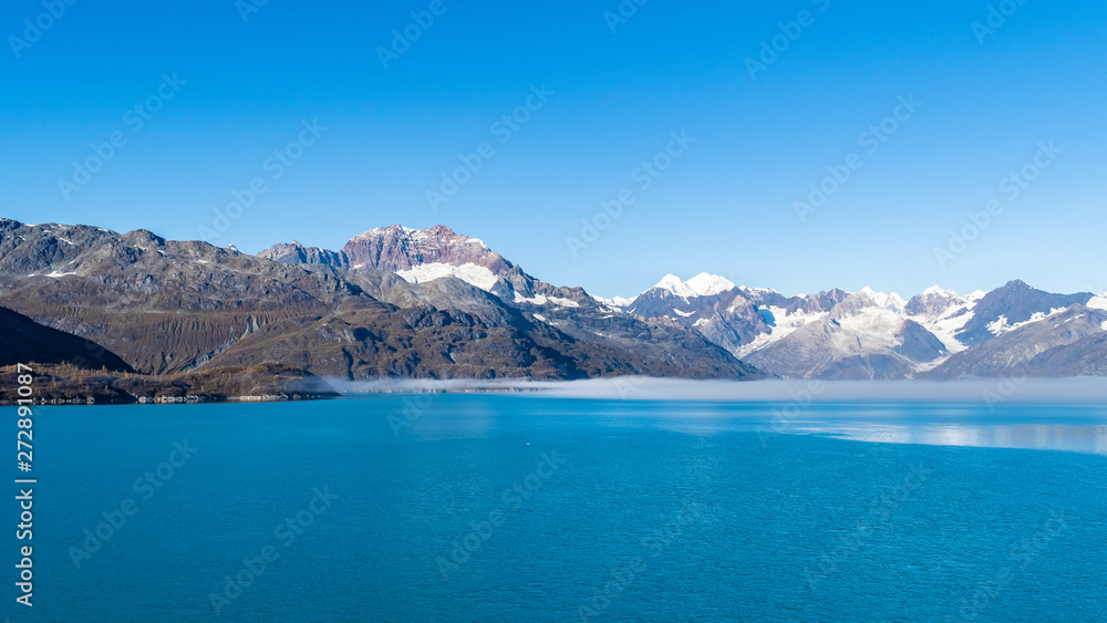 Naklejka premium Glacier Bay National Park, Alaska. Spectacular sweeping vista of ice capped/ snow covered mountains, glaciers, wildlife landscape. Absolutely breathtaking natural untouched serene nature views.