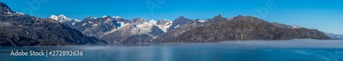 Glacier Bay National Park, Alaska. Spectacular panorama sweeping vista of ice capped/ snow covered landscape of mountains, glaciers, wildlife. Breathtaking view of natural untouched serene nature.