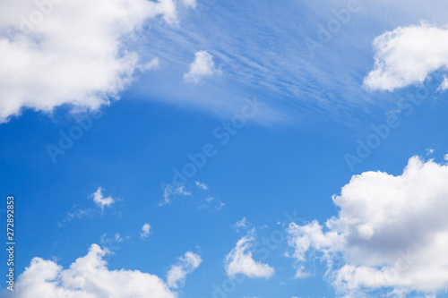 Blue summer sky with white light clouds with place for your design