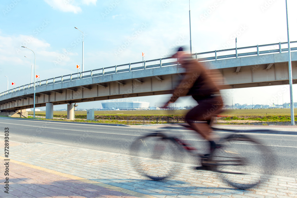 custom made wallpaper toronto digitalfast moving blurred cyclist on the background of a trestle bridge