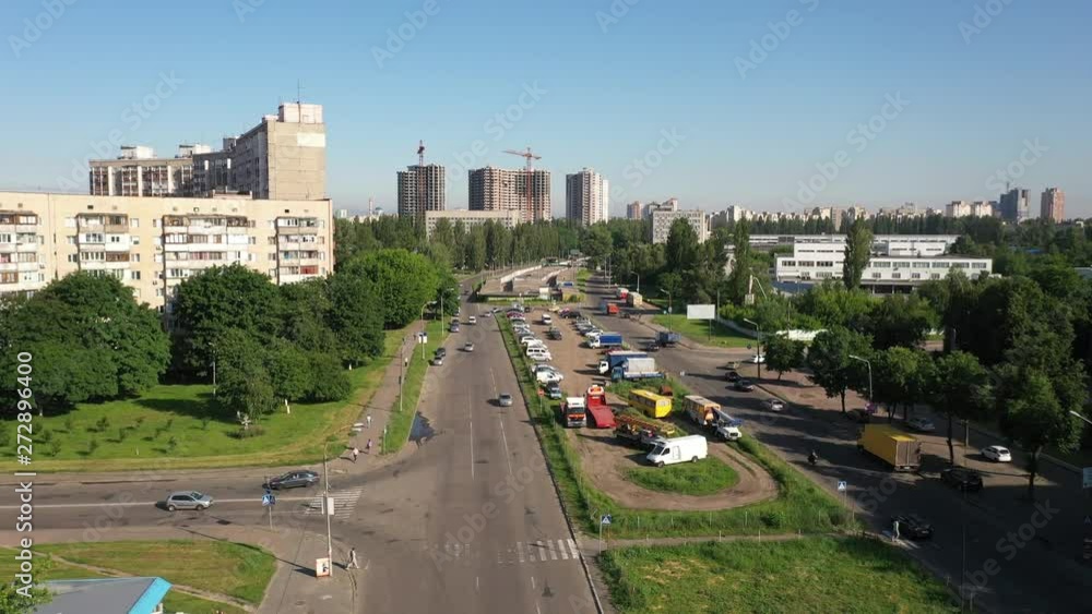 Aerial view of the traffic near an Electric Plant in Kyiv, Ukraine with a construction and cranes as background. Aerial view of the traffic near an Electric Plant in Kyiv, Ukraine with a construction and cranes as background.