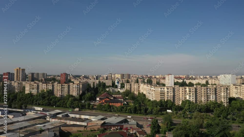 Aerial view of Housing Complex near an Electric Plant in Kyiv, Ukraine with a blue sky as background. Drone flying forward Aerial view of Housing Complex near an Electric Plant in Kyiv, Ukraine with a blue sky as background. Drone flying forward