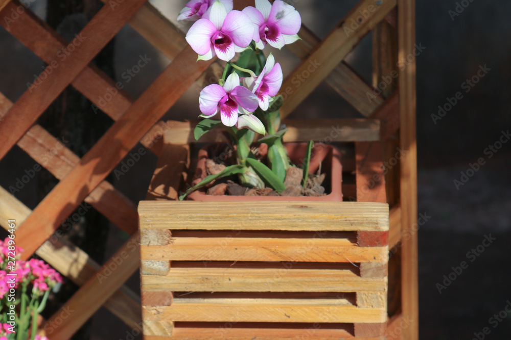 bouquet of flowers in box on wooden table bouquet of flowers in box on wooden table