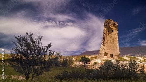 Cinemagraph of swirling clouds and sky behind Cappadocia Turkey ruins in the desert. photo